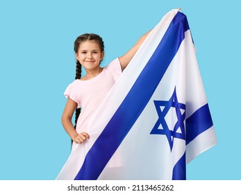 Little girl with the flag of Israel on color background - Shutterstock ID 2113465262