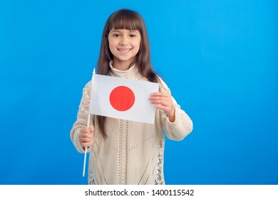 Little Girl With The Flag Of Japan. Education Abroad, Learn Japanese.