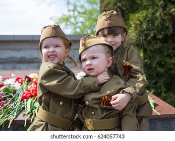 Little Girl With Flowers On The Holiday Of May 9, The Day Of Victory In Russia