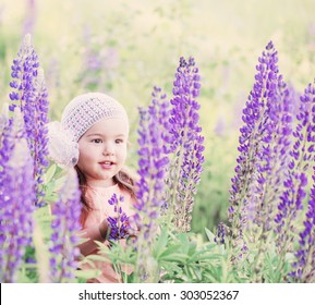 little girl with flowers outdoor