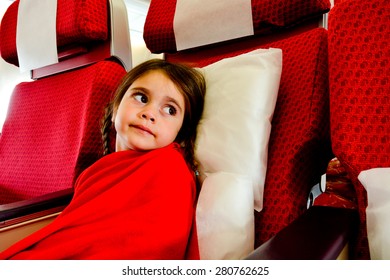 Little Girl With A Flying Phobia In A Plane Scared To Fly During Air Travel Flight.