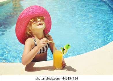 Little girl with fresh  cocktail on watter pool in the summer day - Powered by Shutterstock