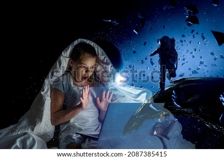 Similar – Boy with sister lighting up with flashlight