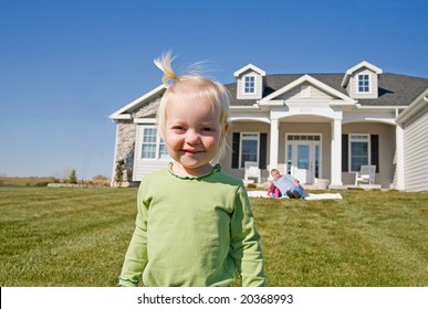 Little Girl in Front of Home