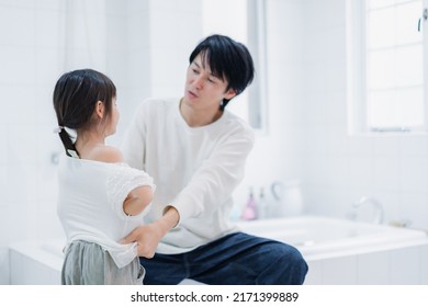 Little Girl Getting Dressed With Daddy