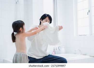 Little Girl Getting Dressed With Daddy