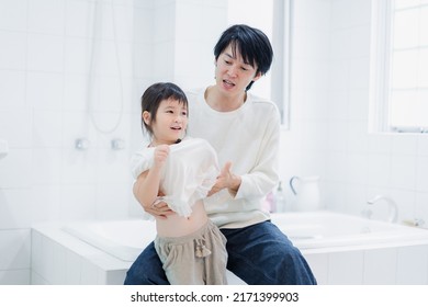 Little Girl Getting Dressed With Daddy