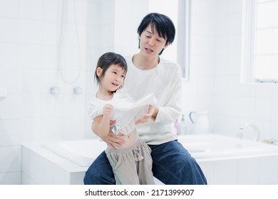 Little Girl Getting Dressed With Daddy