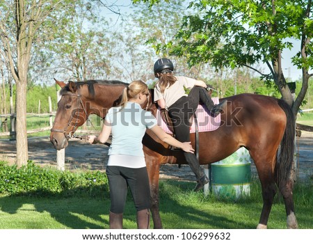 little girl getting a horse