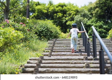 Little Girl Going Up The Stairs