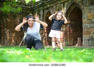 Little Girl Is Going Yoga With Her Yoga Teacher In Park