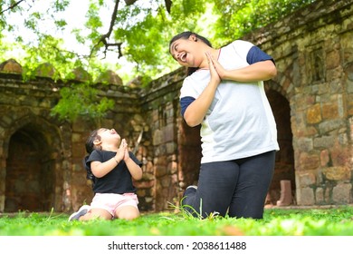 Little Girl Is Going Yoga With Her Yoga Teacher In Park