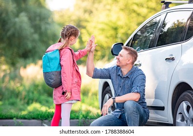 Little girl greeting father after school - Powered by Shutterstock