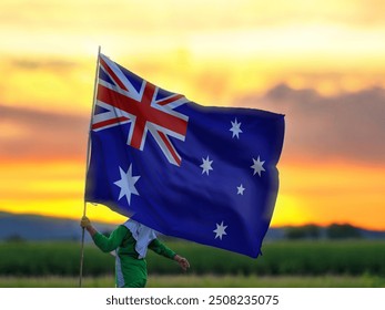 Little girl is happily waving the Australian flag in the field. - Powered by Shutterstock