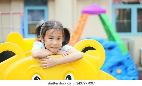 Little girl happy and funny in playground