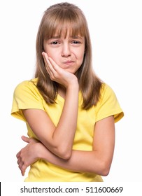 Little Girl Have Toothache, Isolated On White Background. Emotional Portrait Of Caucasian Girl Wearing Yellow T-shirt. Sad Child With Tooth Pain. Dental Problem - Kid Suffering From Toothache.