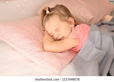 Little Girl Having Bad Dream While Sleeping In Bed At Home