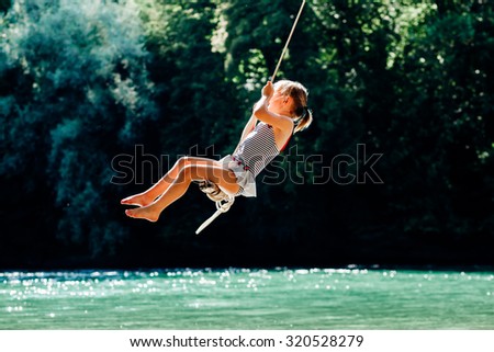 Similar – Image, Stock Photo Swimming fun at quarry pond, young adults swing into the water