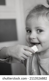 Little Girl Helps Mom Cook