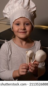 Little Girl Helps Mom Cook