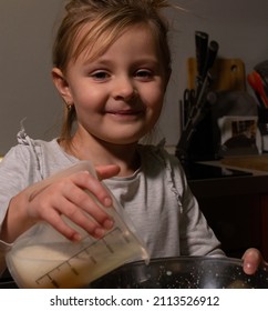 Little Girl Helps Mom Cook