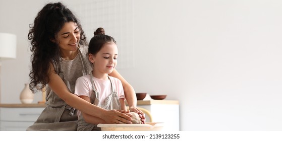 Little Girl And Her Mother Making Ceramic Pot At Home