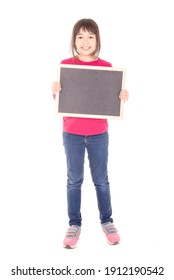 little girl holding a blackboard isolated in white
