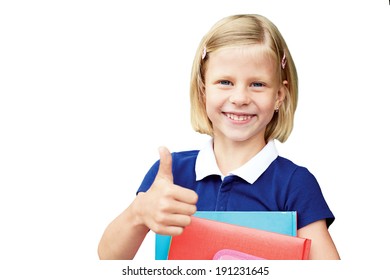 Little girl holding notebooks at the school