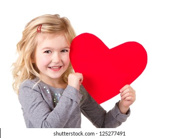 Little girl holding red heart, close-up isolated on white