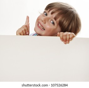 little girl holding  white board with empty space for text or picture