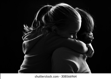 Little girl hugs her mother - Powered by Shutterstock