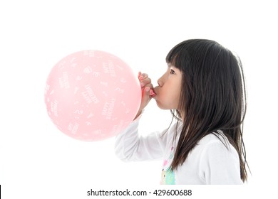 Little Girl inflate a Pink Balloon with Happy birthday message on the White Background
