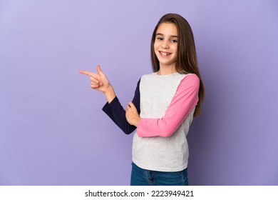 Little girl isolated on purple background pointing finger to the side - Powered by Shutterstock