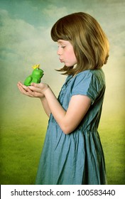 Little Girl Kissing A Frog Prince