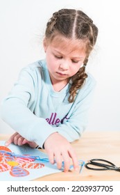 Little Girl Learning How To Sew With Sewing Craft Kit For Kids.