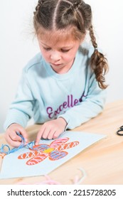 Little Girl Learning How To Sew With Sewing Craft Kit For Kids.