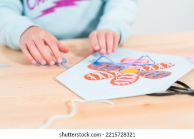 Little Girl Learning How To Sew With Sewing Craft Kit For Kids.