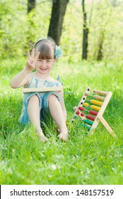 Little girl learns  count outdoor. Education concept. Learning