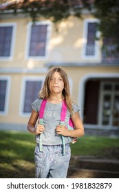 Little Girl Leaving School Building. 