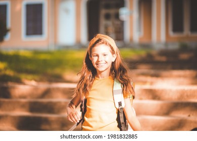 Little Girl Leaving School Building. 