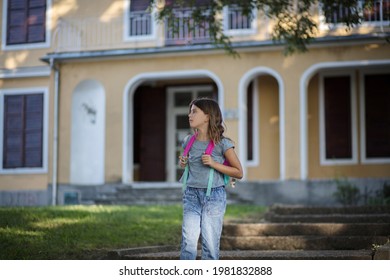 Little Girl Leaving School Building. 