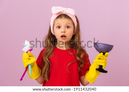 A little girl likes to keep the house clean. Hygiene and cleanliness in the house.