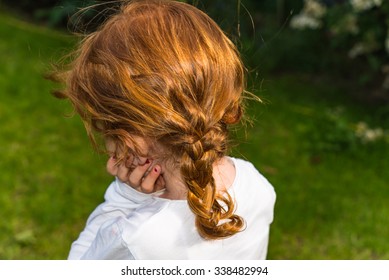 Little Girl With Long Red Hair Wearing A White T-Shirt. 
Closeup Of Ginger Haired Female Child With Glossy Curls, Perfect For Family Blog, Website, Magazine