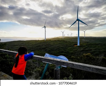Little girl is looking at the amazing Wind Farm, Albany, Western Australia. 