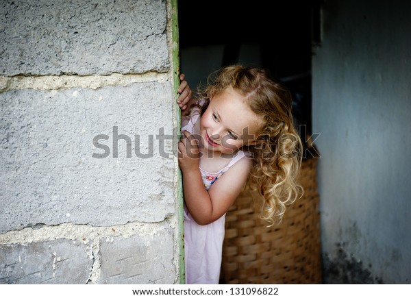 Little Girl Looking Out Door Stock Photo 131096822 | Shutterstock