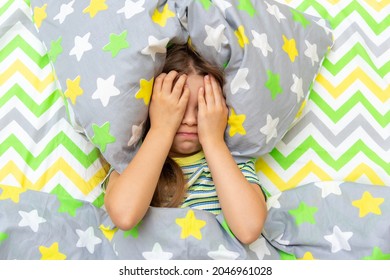 A Little Girl Is Lying In Bed And Is Naughty, Crying And Does Not Want To Get Up, Go To School.