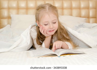 Little Girl Lying On Bed Reading Stock Photo 343893338 | Shutterstock