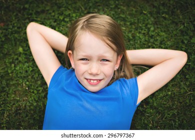 Little Girl Lying On Grass Stock Photo 296797367 