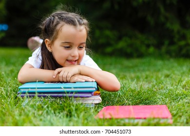 Little Girl Lying On Her Stomach Stock Photo 704451073 | Shutterstock