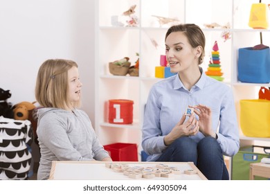 Little Girl Makes Shapes Her Mouth During Speech Therapy